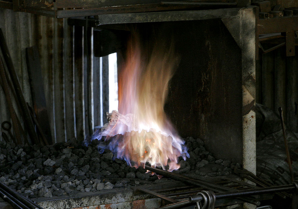 The glowing furnace of a blacksmith