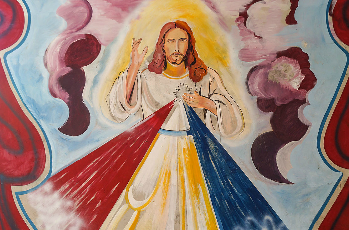 A painting of Christ on the wall of a house in La Cañada de Urdaneta