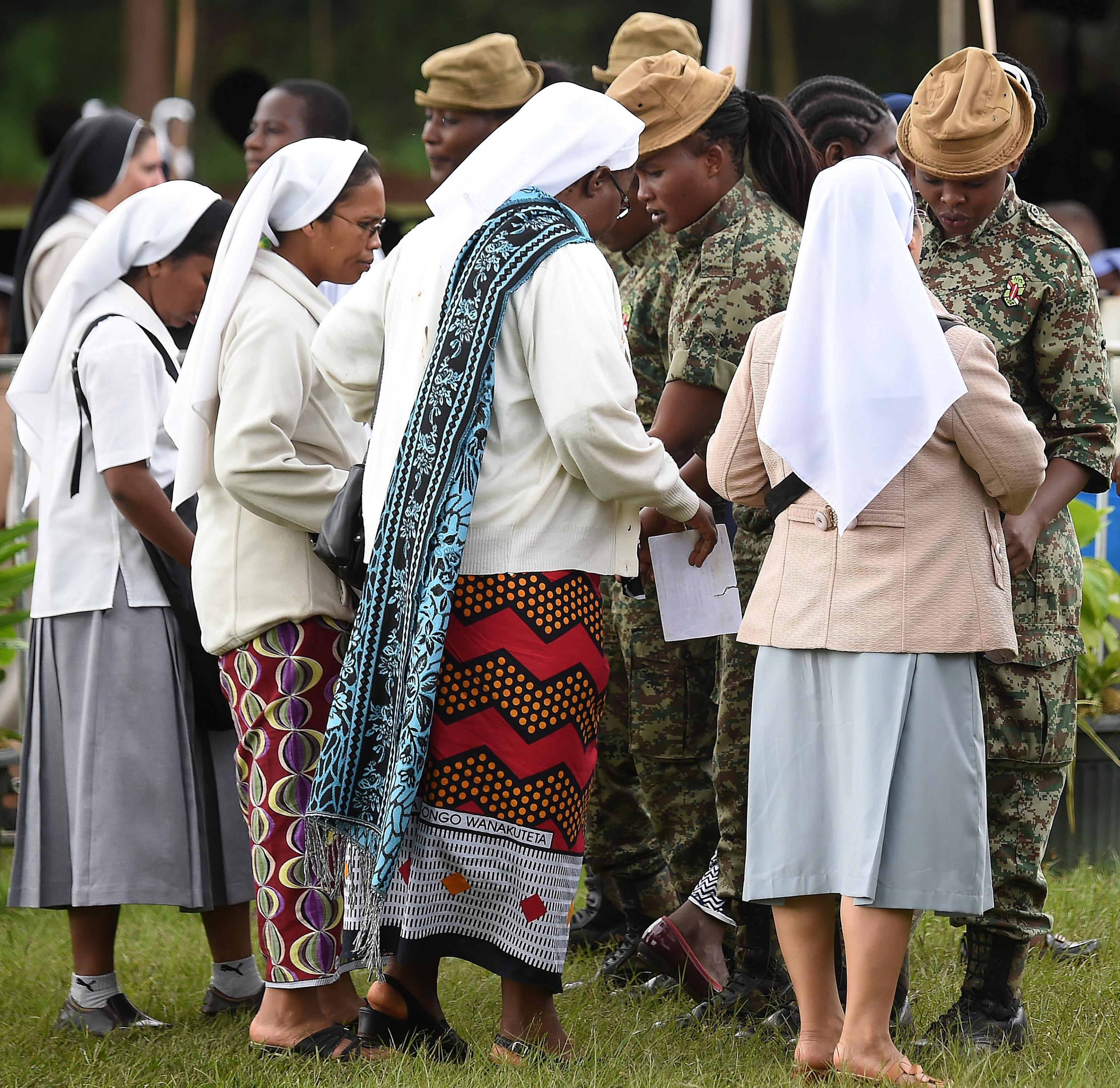 Nuns are checked by security army upon their arrival at the St. Mary's school to attend a meeting of Pope Francis and the clergy and religious in Nairobi