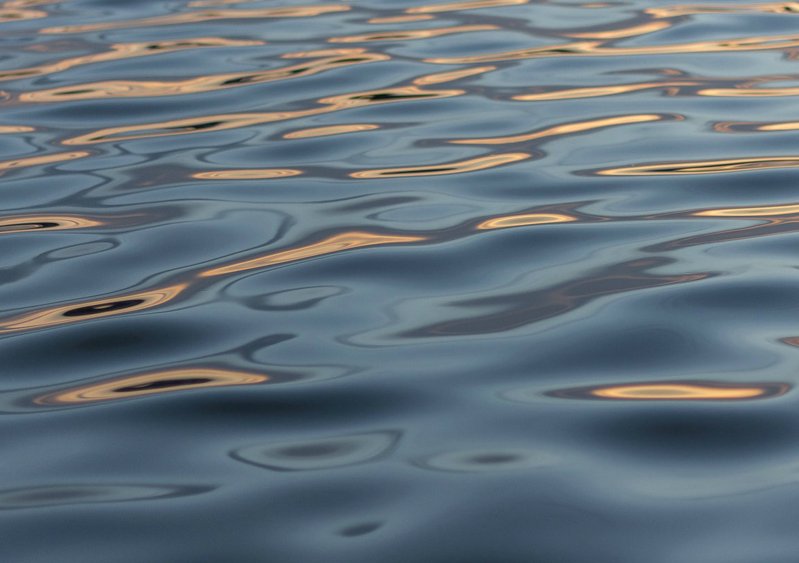 Water waves or undulations that travel through water
