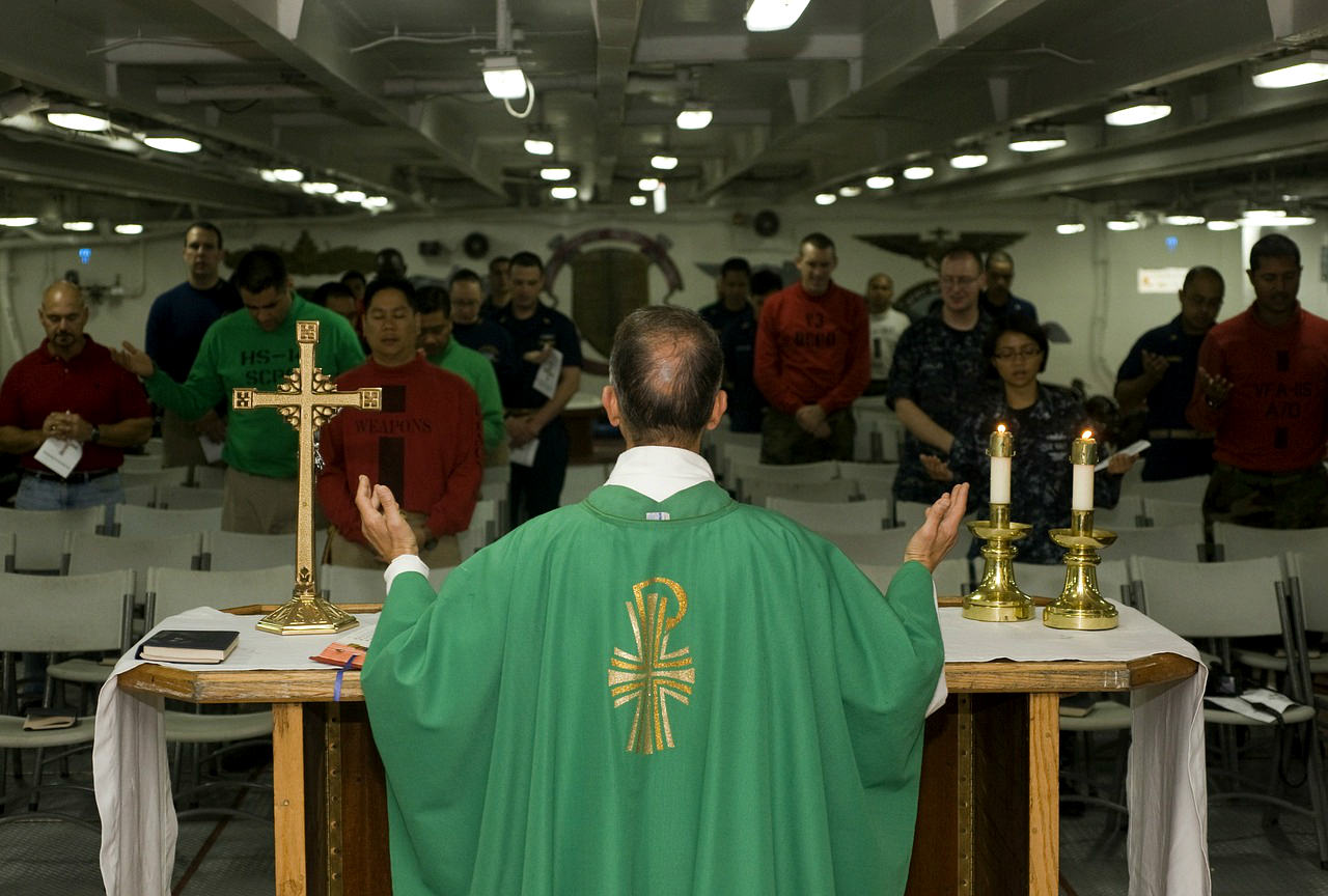 A priest celebrates Holy Mass on board of a warship