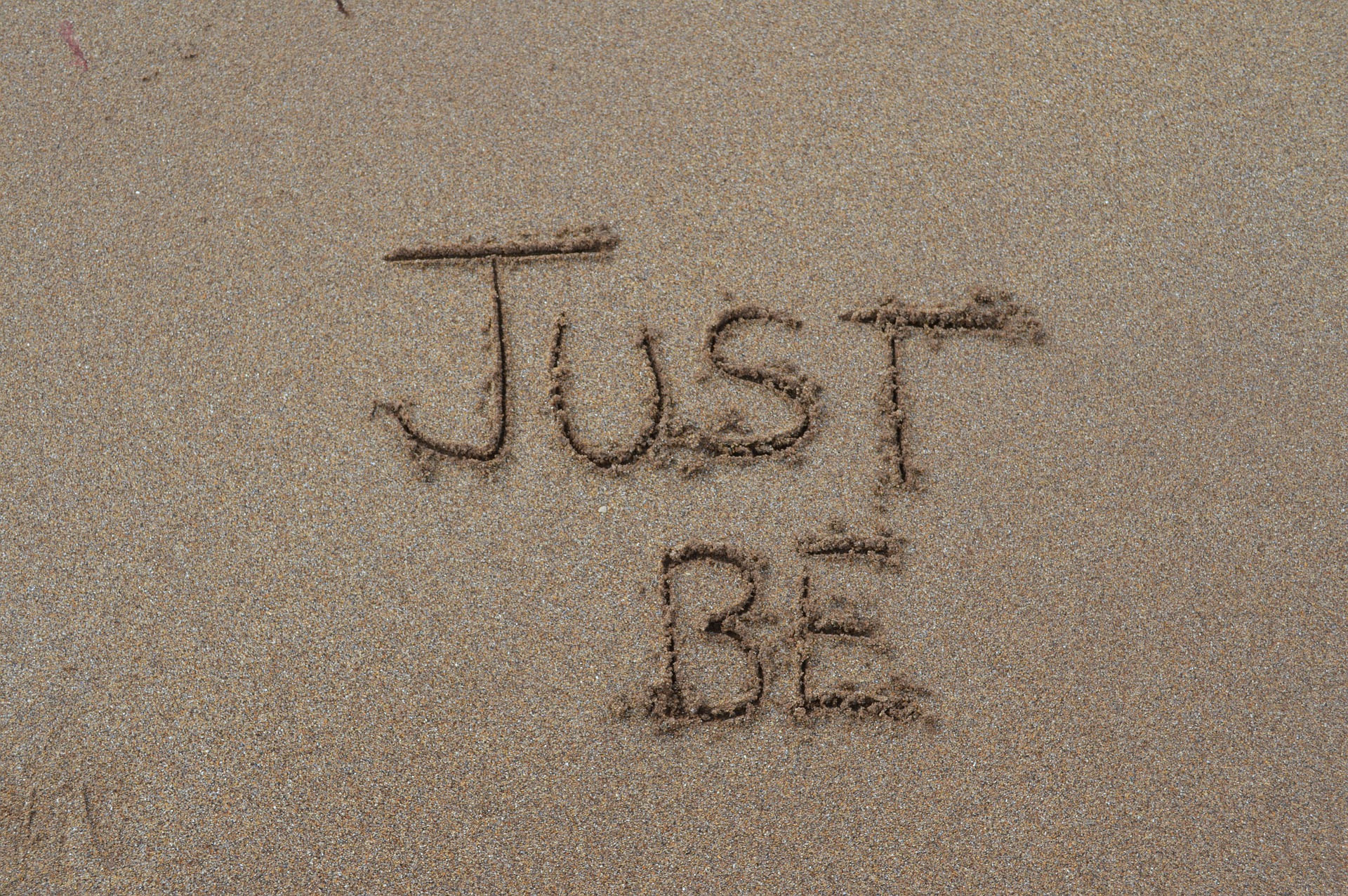 Written in the sand "Just be"