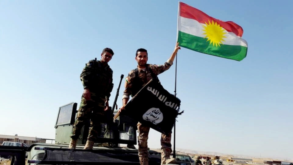 Peshmerga throw away the ISIS flag and hang up the Kurdish flag